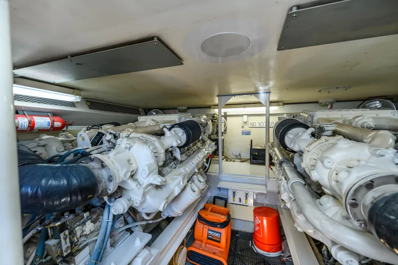 Marysea Yacht Photos Pics Engine room of 1999 Viking 58 Convertible yacht, featuring dual engines and equipment.