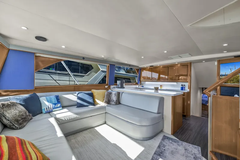 Marysea Yacht Photos Pics Luxurious interior of 1999 Viking 58 Convertible yacht with modern seating and kitchen area.