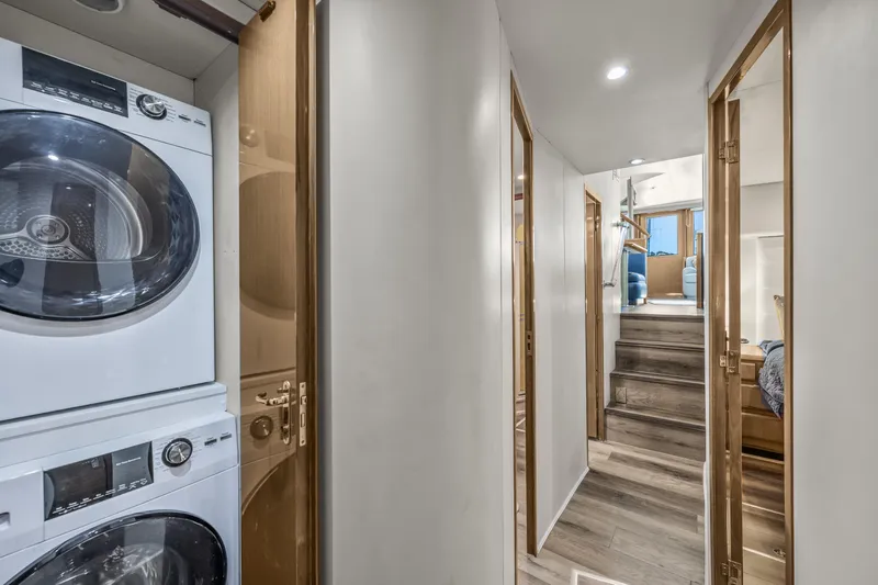 Marysea Yacht Photos Pics Interior hallway of 1999 Viking 58 Convertible yacht with laundry appliances.