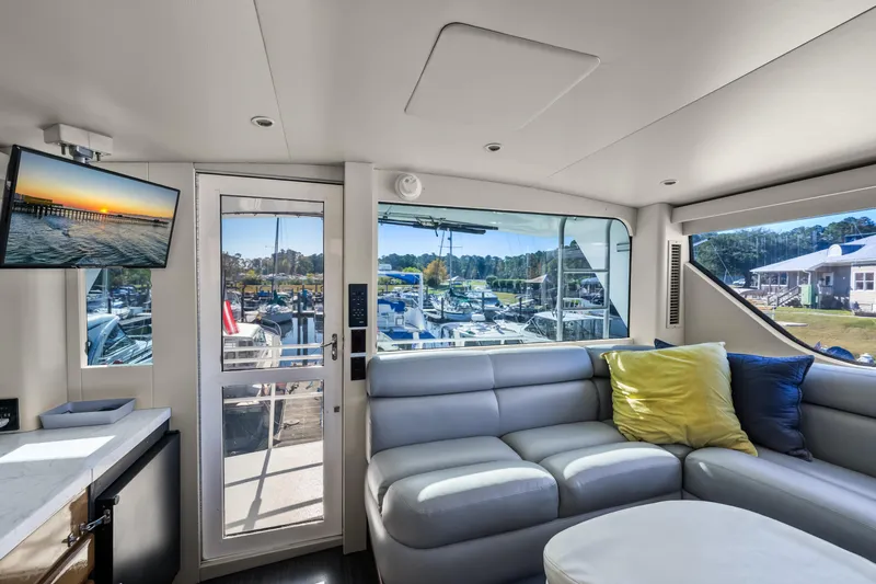 Marysea Yacht Photos Pics Luxurious interior of 1999 Viking 58 Convertible yacht with marina view.