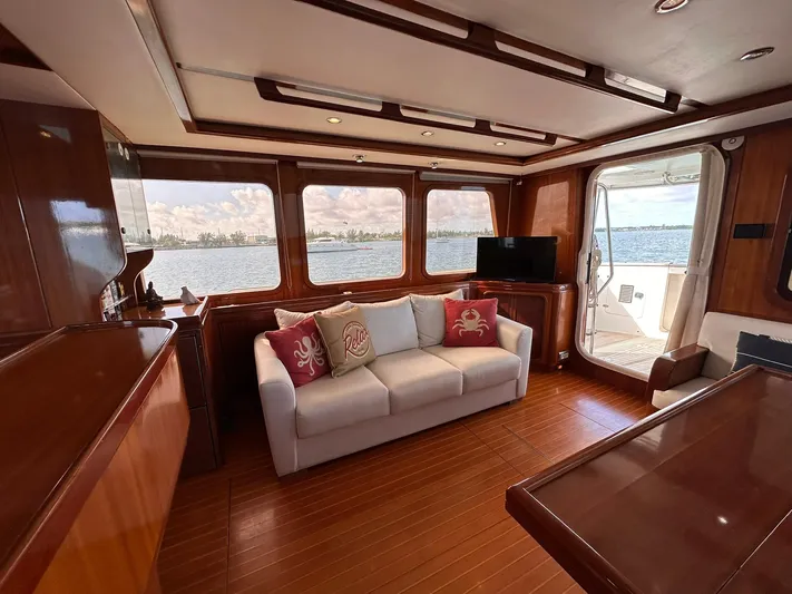 Beyond Capricorn 1 Yacht Photos Pics Luxurious 2001 Nordhavn 57 yacht interior with elegant wood finish and comfortable seating.