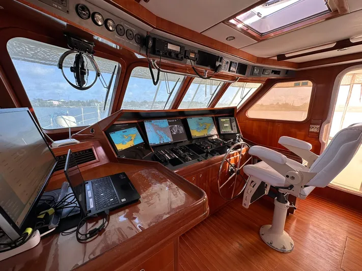 Beyond Capricorn 1 Yacht Photos Pics Pilothouse of 2001 Nordhavn 57 yacht with navigation screens and control systems.