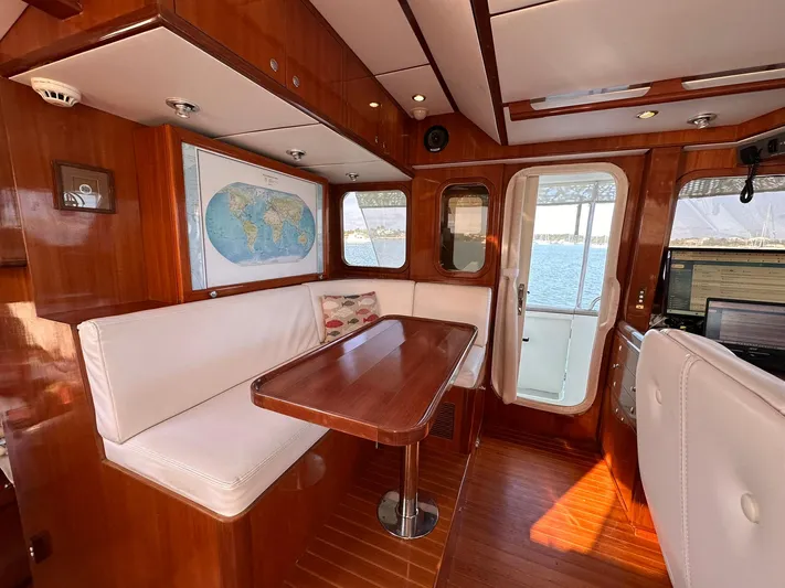 Beyond Capricorn 1 Yacht Photos Pics Luxurious 2001 Nordhavn 57 yacht interior with wood finish and ocean view.