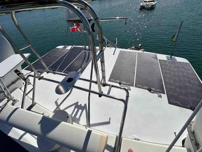 Beyond Capricorn 1 Yacht Photos Pics Nordhavn 57 yacht deck with solar panels, 2001 model, on calm water.