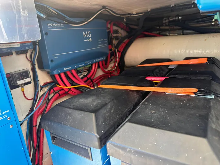 Beyond Capricorn 1 Yacht Photos Pics Electrical system of a 2001 Nordhavn 57 yacht, featuring batteries and wiring.