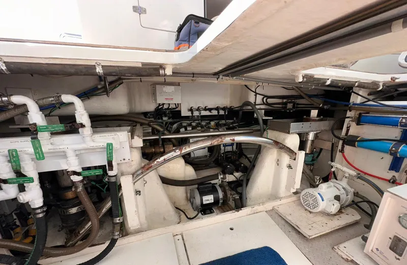 Beyond Capricorn 1 Yacht Photos Pics Engine room of a 2001 Nordhavn 57 yacht, showcasing mechanical systems and components.