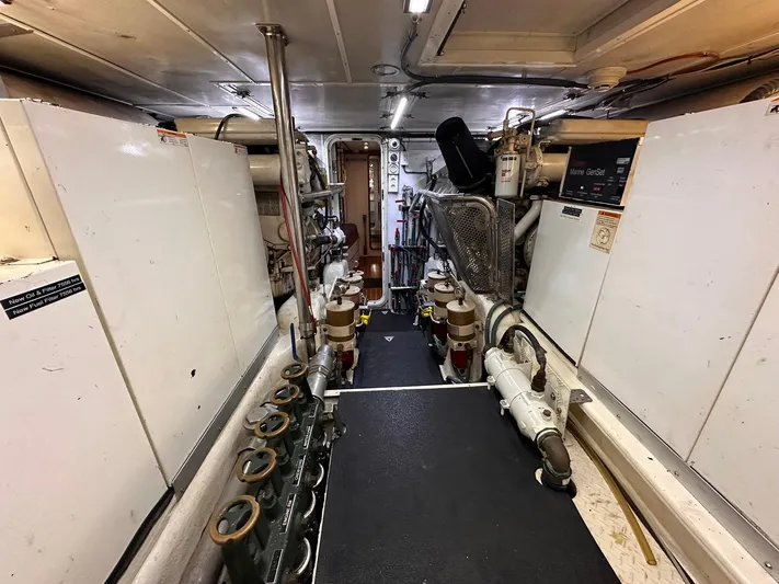 Beyond Capricorn 1 Yacht Photos Pics Engine room of a 2001 Nordhavn 57 yacht, featuring machinery and equipment.