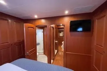 Oasis Yacht Photos Pics Luxurious Northwest 55 yacht interior, 2024 model, featuring wood paneling and modern amenities.