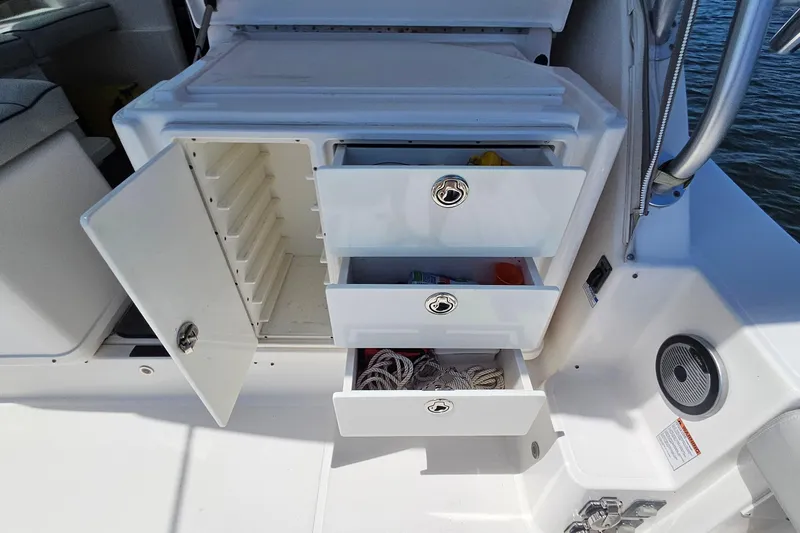 T-time Yacht Photos Pics 2006 Tiara 3200 Open boat storage with open drawers and compartments.