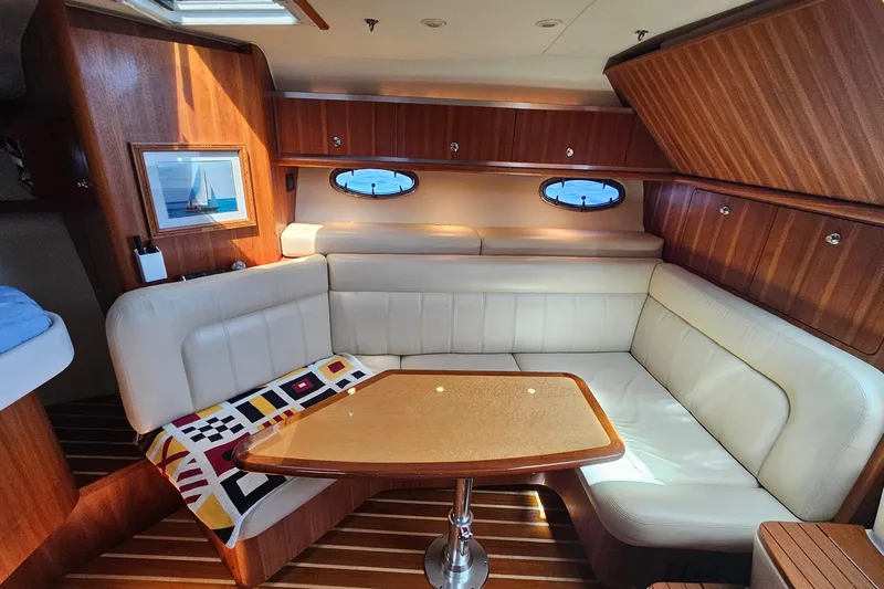 T-time Yacht Photos Pics Luxurious interior of 2006 Tiara 3200 Open yacht with elegant seating and wooden finishes.