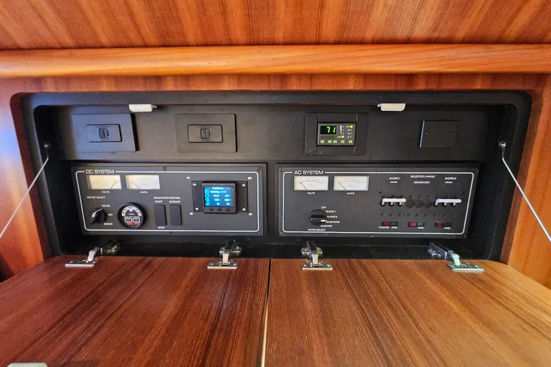 T-time Yacht Photos Pics Electrical control panel of a 2006 Tiara 3200 Open boat, featuring AC and DC systems.