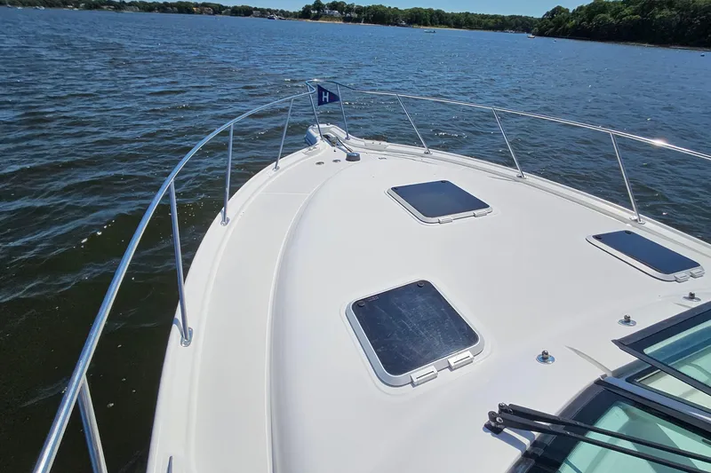 T-time Yacht Photos Pics 2006 Tiara 3200 Open yacht on calm water, showcasing sleek deck design.