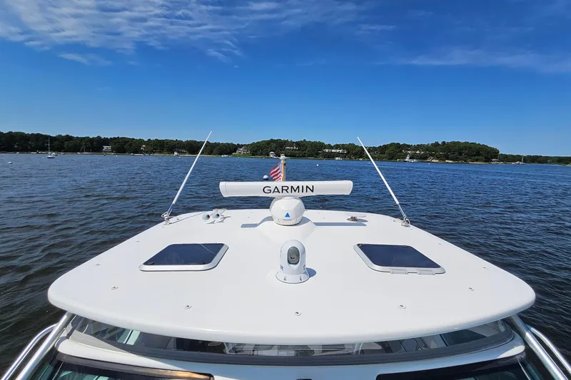 T-time Yacht Photos Pics 2006 Tiara 3200 Open yacht with Garmin equipment on a serene lake.