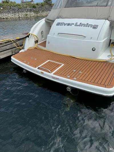 Yacht Photos Pics 2008 Formula 400 Super Sport boat docked, featuring teak swim platform and "Silver Lining" name.