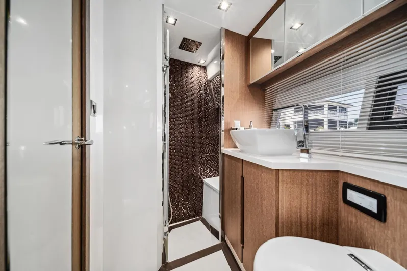 Yacht Photos Pics Luxurious bathroom interior of 2019 Galeon 560 Sky yacht with modern fixtures.