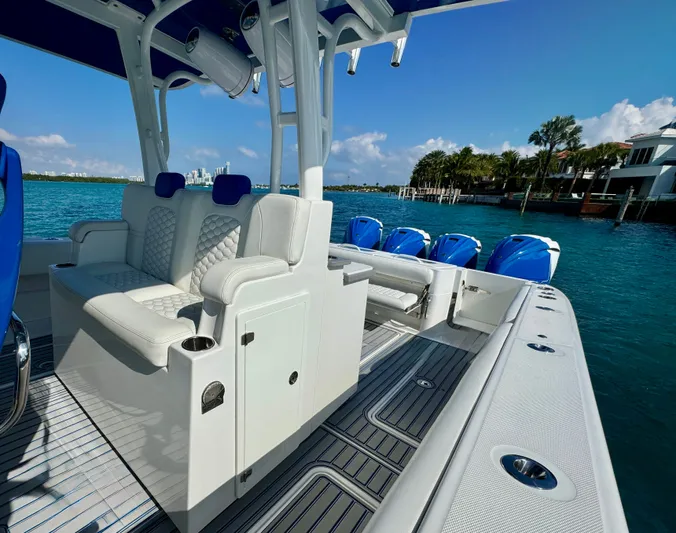  Yacht Photos Pics 2019 HCB 42 Siesta boat with luxurious seating and multiple engines on a sunny day.