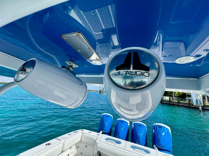  Yacht Photos Pics 2019 HCB 42 Siesta boat with JL Audio speakers, blue water backdrop.