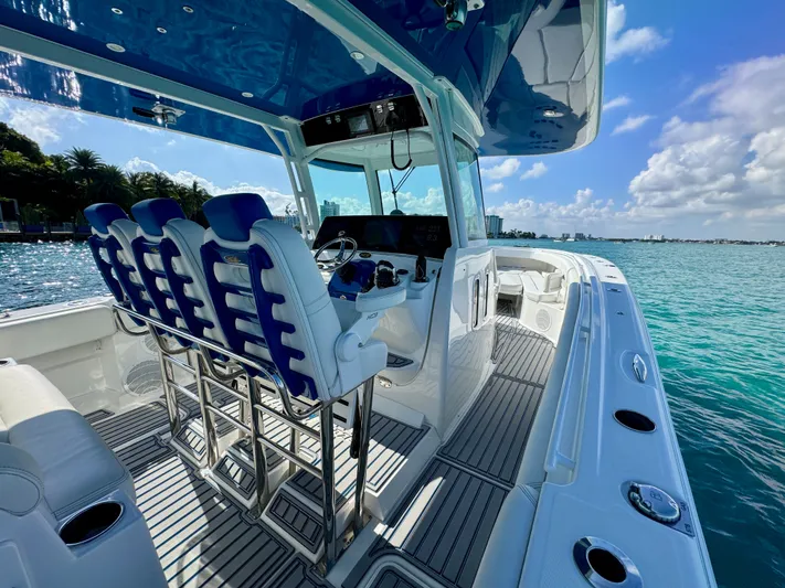  Yacht Photos Pics 2019 HCB 42 Siesta boat interior with blue seating, ocean view, and clear skies.