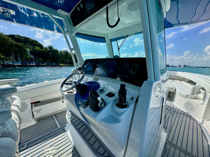  Yacht Photos Pics 2019 HCB 42 Siesta boat interior with modern helm, steering wheel, and ocean view.