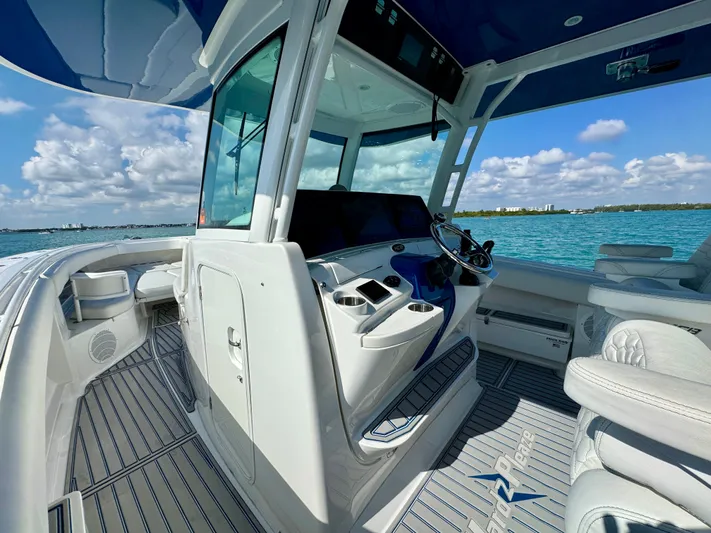  Yacht Photos Pics 2019 HCB 42 Siesta boat interior with helm, ocean view, and clear skies.
