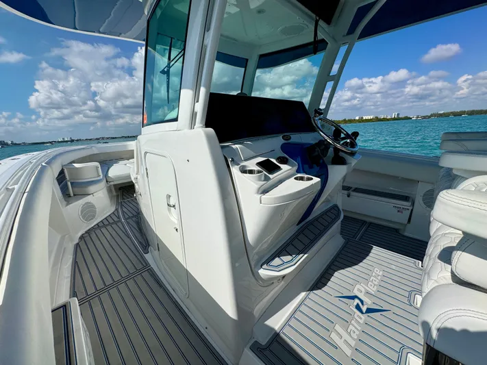  Yacht Photos Pics 2019 HCB 42 Siesta boat interior with helm, ocean view, and clear skies.
