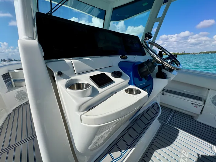  Yacht Photos Pics 2019 HCB 42 Siesta boat helm with steering wheel and controls, overlooking blue water.