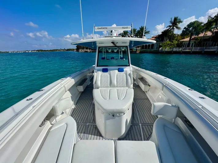  Yacht Photos Pics 2019 HCB 42 Siesta boat on clear blue water, featuring luxurious seating and Garmin equipment.