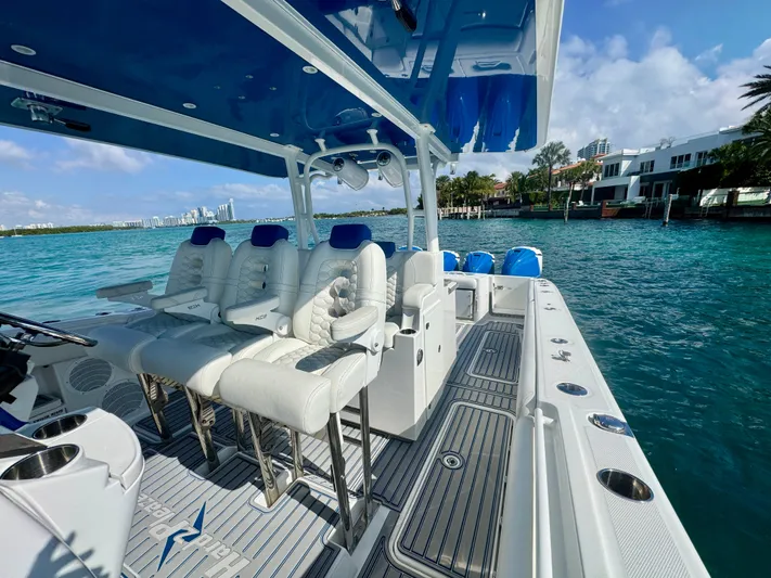  Yacht Photos Pics 2019 HCB 42 Siesta boat with luxurious seating, cruising on clear blue waters.