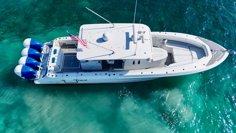  Yacht Photos Pics Aerial view of 2019 HCB 42 Siesta boat on clear turquoise water.