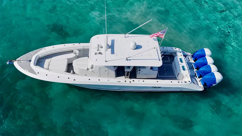  Yacht Photos Pics 2019 HCB 42 Siesta boat on clear turquoise water, aerial view.