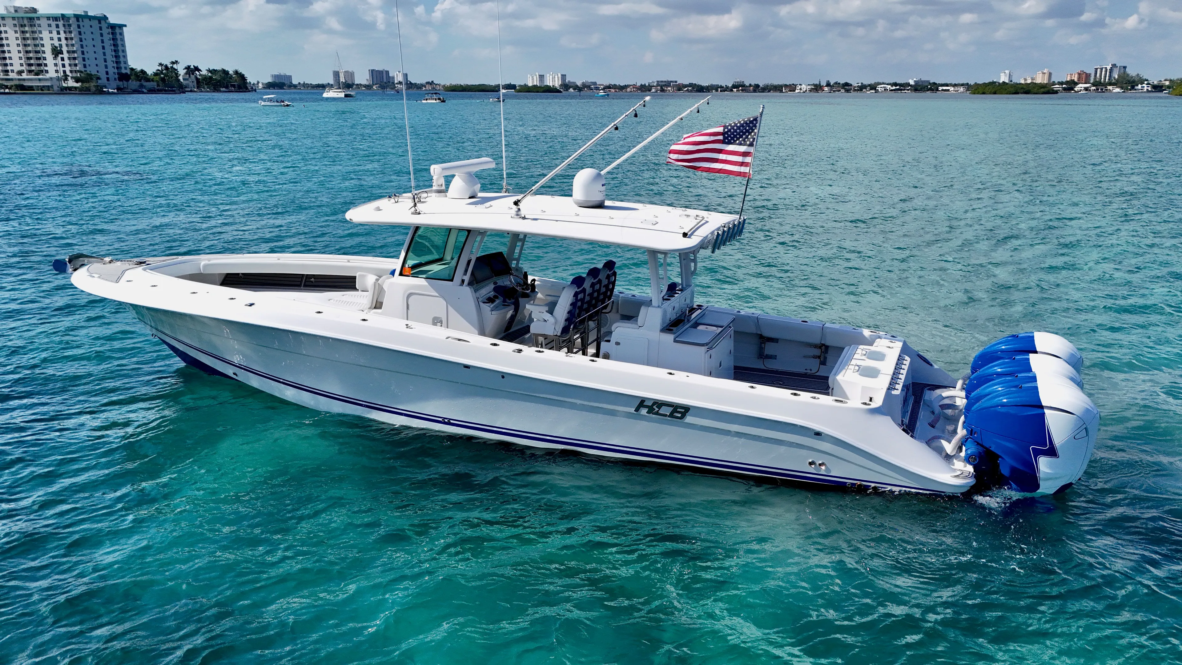  Yacht Photos Pics 2019 HCB 42 Siesta boat on clear blue water with American flag.