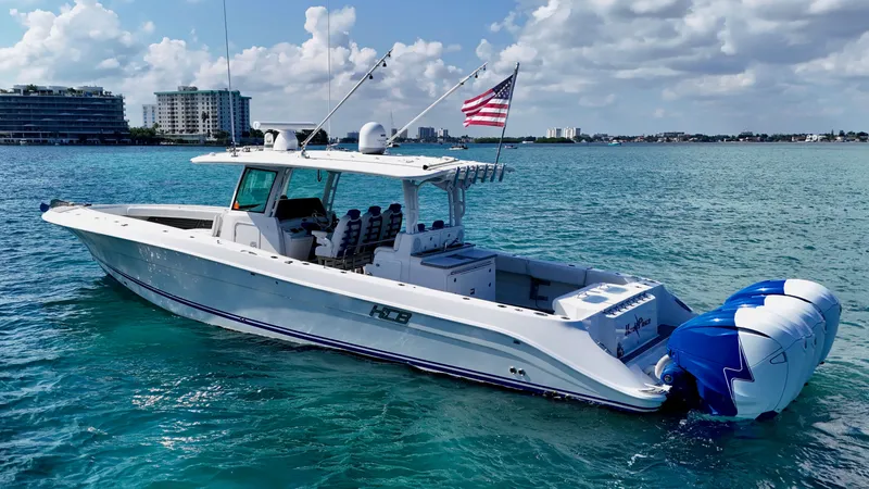  Yacht Photos Pics 2019 HCB 42 Siesta boat on clear blue water with American flag.