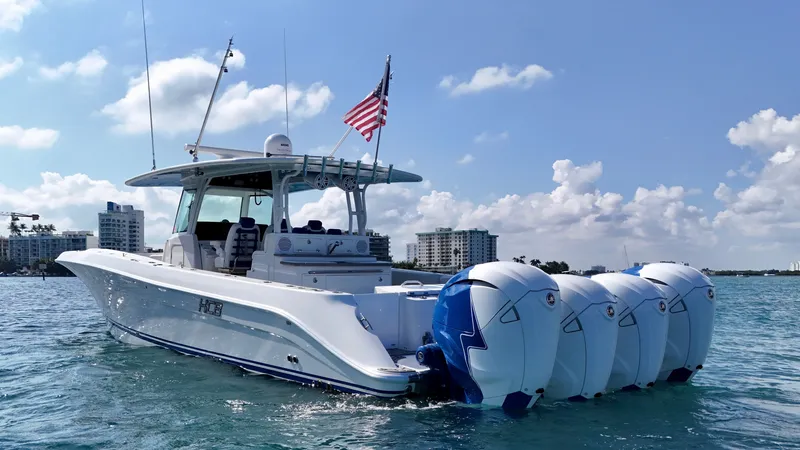  Yacht Photos Pics 2019 HCB 42 Siesta boat with four engines on water, American flag flying.