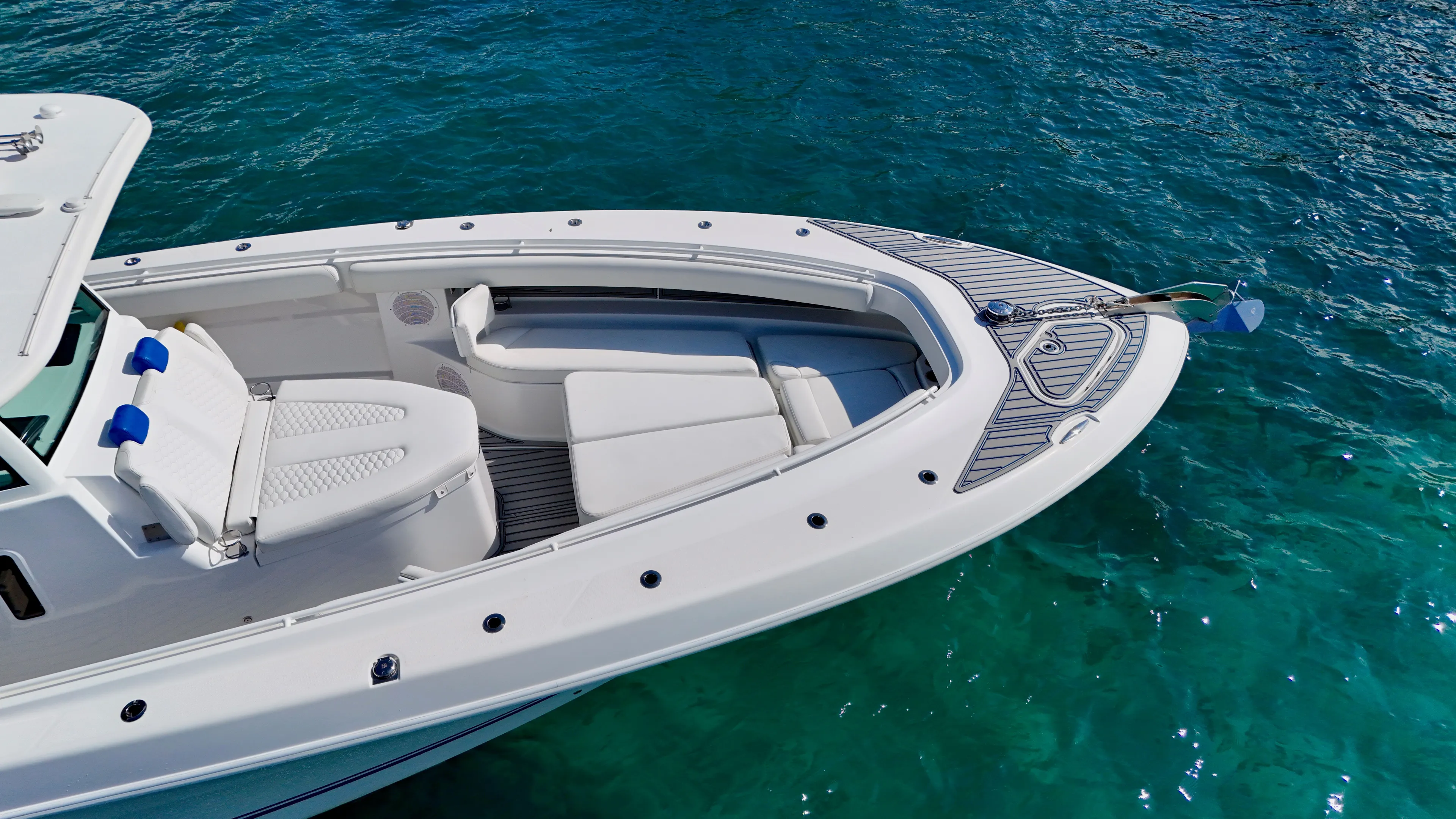  Yacht Photos Pics 2019 HCB 42 Siesta boat with white seating on clear blue water.