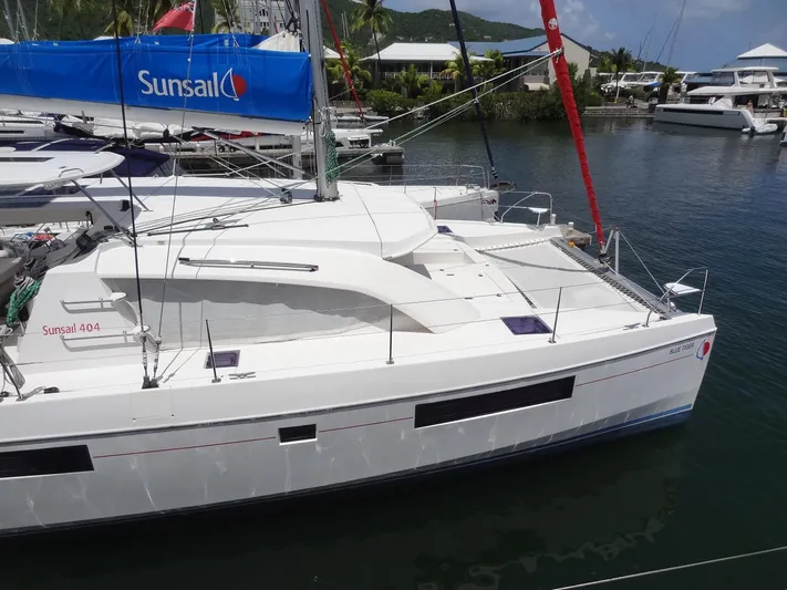 Blue Tiger Yacht Photos Pics 2021 Leopard 40 catamaran docked in marina, featuring Sunsail branding and sleek design.