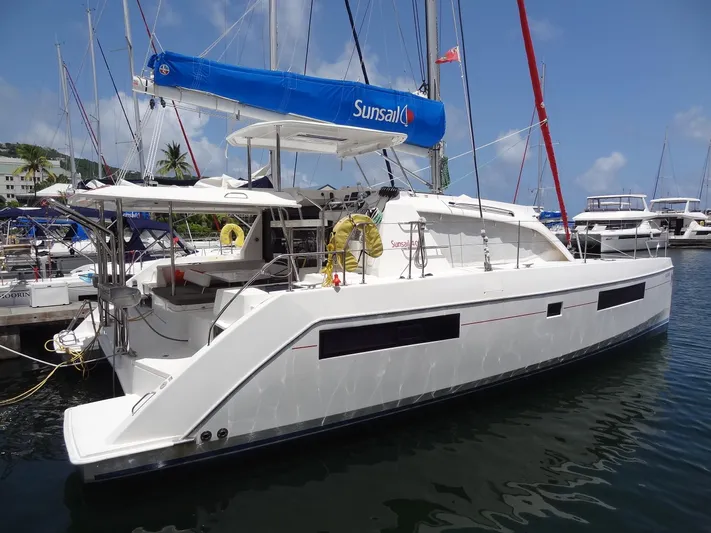 Blue Tiger Yacht Photos Pics 2021 Leopard 40 catamaran docked at marina, featuring blue sail and modern design.