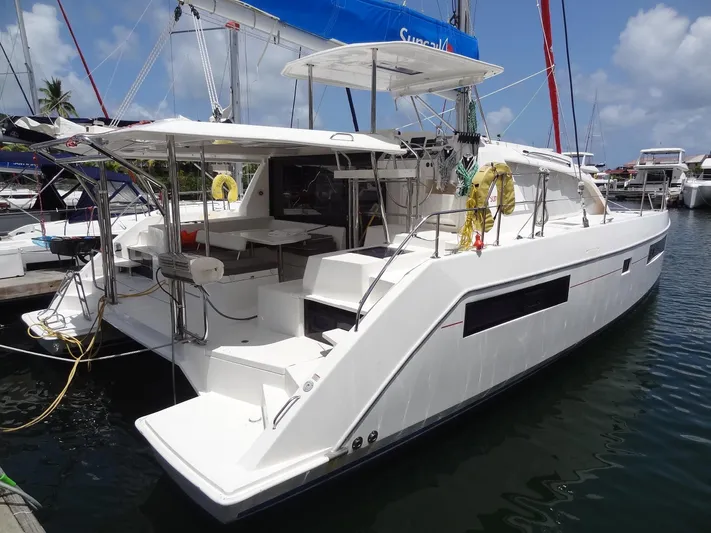 Blue Tiger Yacht Photos Pics 2021 Leopard 40 catamaran docked at marina under clear blue sky.