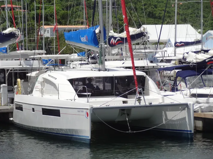 Blue Tiger Yacht Photos Pics 2021 Leopard 40 catamaran docked at marina, featuring sleek design and modern sails.