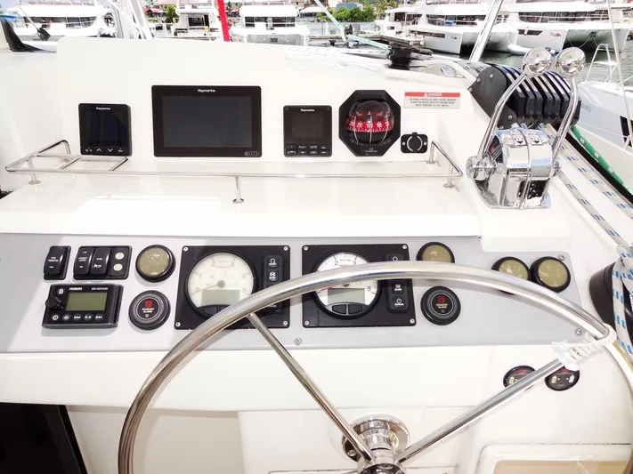 Blue Tiger Yacht Photos Pics Helm of 2021 Leopard 40 catamaran with navigation instruments and steering wheel.