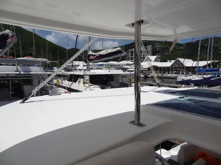 Blue Tiger Yacht Photos Pics Leopard 40 catamaran docked at marina, surrounded by other boats, 2021 model.