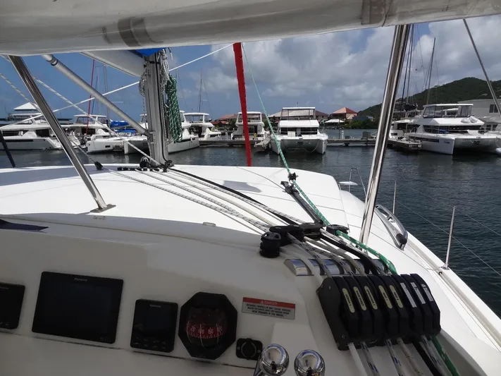 Blue Tiger Yacht Photos Pics 2021 Leopard 40 catamaran docked at marina with other boats in background.