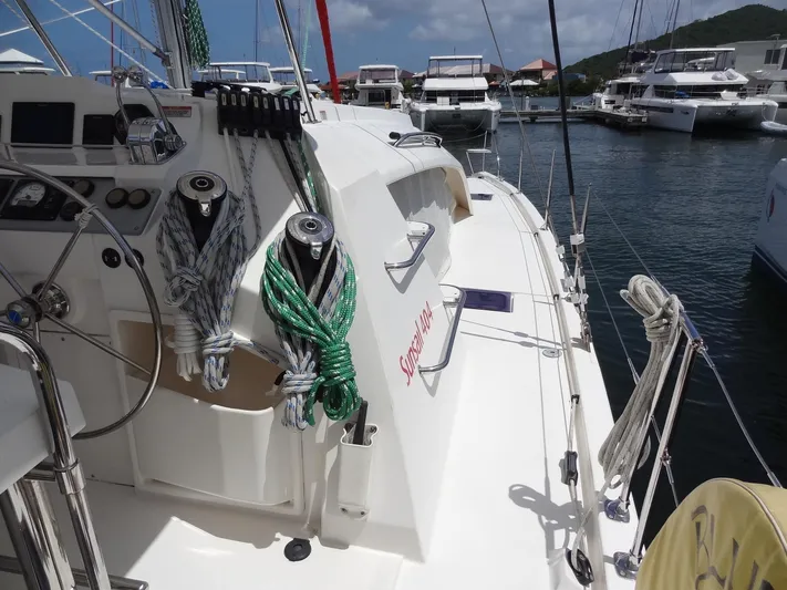 Blue Tiger Yacht Photos Pics Sailing yacht Leopard 40, 2021 model, docked in a marina with clear skies.