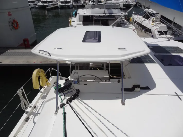 Blue Tiger Yacht Photos Pics 2021 Leopard 40 catamaran docked at marina, featuring spacious deck and modern design.