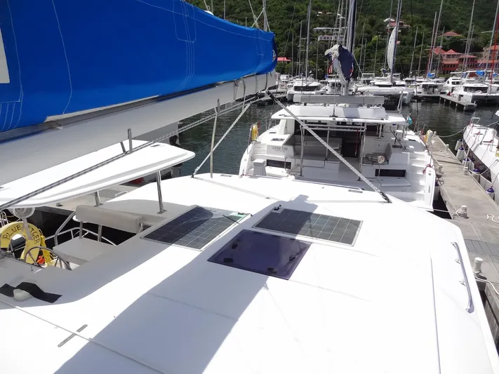 Blue Tiger Yacht Photos Pics Leopard 40 catamaran, 2021 model, docked in marina with solar panels and blue sail cover.