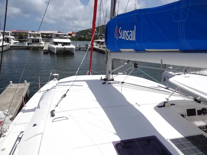 Blue Tiger Yacht Photos Pics Leopard 40 catamaran docked at marina, featuring Sunsail branding, under a clear sky.