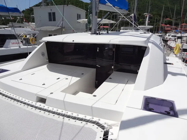 Blue Tiger Yacht Photos Pics 2021 Leopard 40 catamaran with open deck and modern design in marina setting.