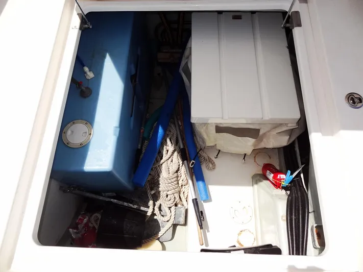 Blue Tiger Yacht Photos Pics Storage compartment of a 2021 Leopard 40 boat with ropes and equipment.