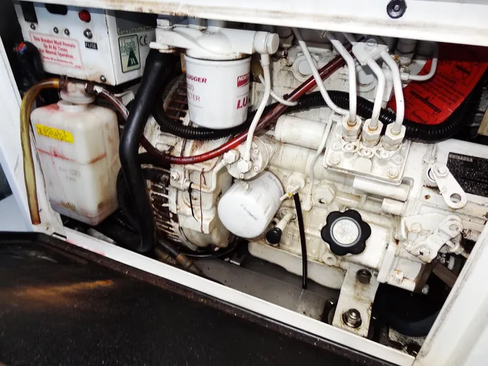 Blue Tiger Yacht Photos Pics Engine compartment of a 2021 Leopard 40, showcasing mechanical components and fluid reservoirs.