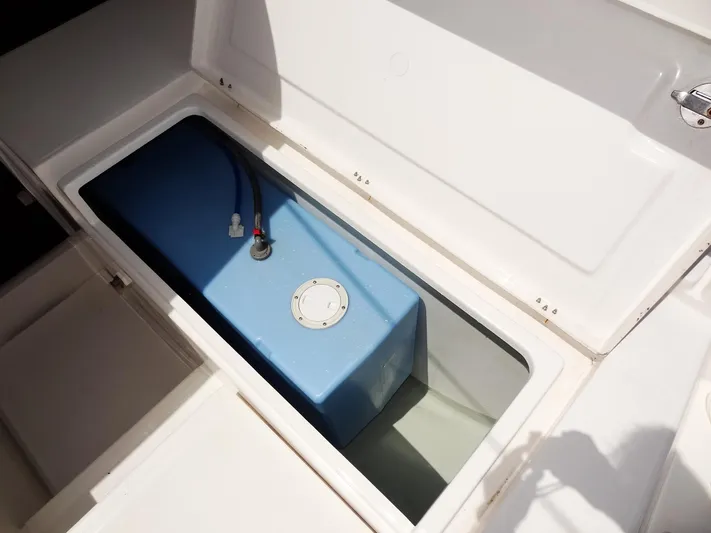 Blue Tiger Yacht Photos Pics Storage compartment with blue tank on a 2021 Leopard 40 boat.