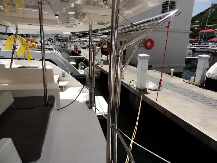 Blue Tiger Yacht Photos Pics Leopard 40 catamaran docked at marina, showcasing sleek design and spacious deck, 2021 model.